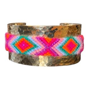 Brass cuff with Southwestern braided bright accent. Adjustable. J25